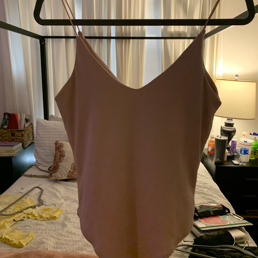 Light pink body suit size medium